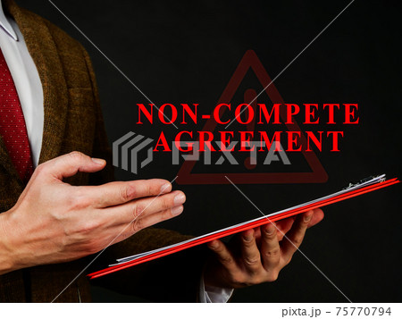 Non compete agreement or clause in the red folder. 75770794