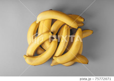 Fresh bunch of yellow bananas isolated on a Gray background Trendy colors of 2021 75772071