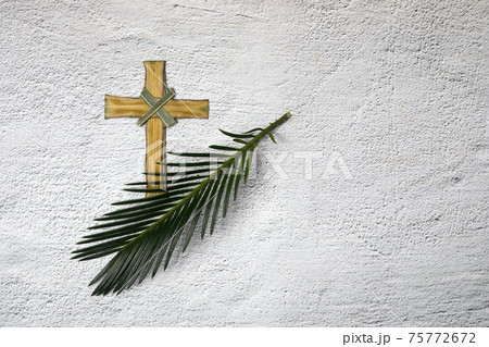 Palm sunday background. Cross and palm on grey background. Palm sunday background. Cross and palm on grey background. 75772672