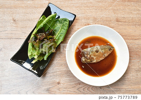 boiled mackerel fish sauce soup on plate with fresh vegetable boiled mackerel fish sauce soup on plate with fresh vegetable 75773789