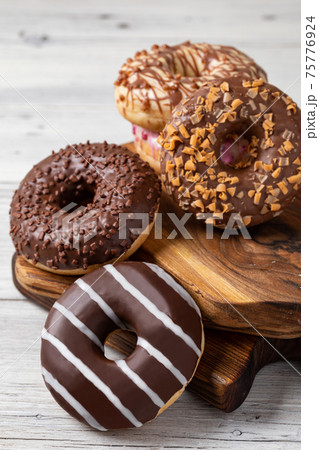 donuts on a wooden background 75776924