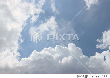 Summer clouds against the blue sky. 75778311
