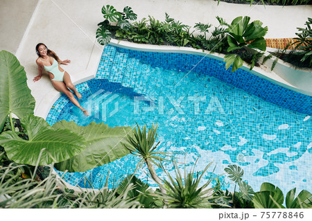 Woman enjoying sunbathing Woman enjoying sunbathing 75778846