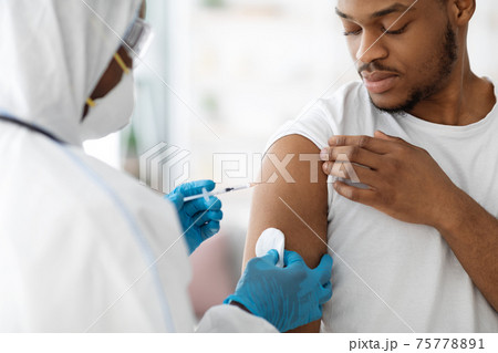 Doctor making flu vaccine for black guy 75778891