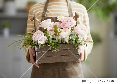 Florist Holding Flowers Close Up 75779336
