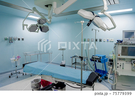The operating room in the hospital with all the equipment in white and blue. The operating room in the hospital with all the equipment in white and blue. 75779399