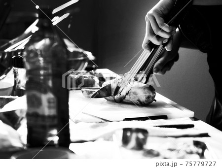 Chef cooking in a kitchen, chef at work, Black and White. 75779727