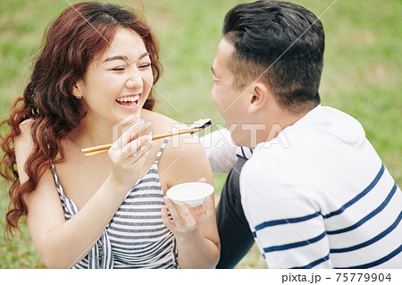Feeding boyfriend with suchi Feeding boyfriend with suchi 75779904