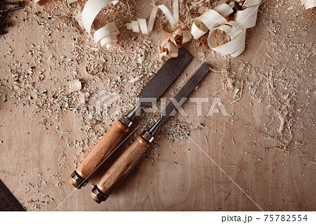 Carpenter's chisel, woodwork tool on the desktop in the workshop 75782554