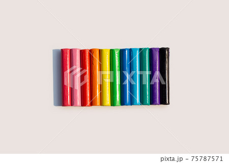Colorful plasticine clay on white. Colorful plasticine clay on white. 75787571