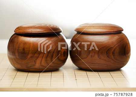 Go game stones in wooden bowls - Goban, Baduk, Weiqi or Maklom - Traditional asian strategy board game Go game stones in wooden bowls - Goban, Baduk, Weiqi or Maklom - Traditional asian strategy board game 75787928