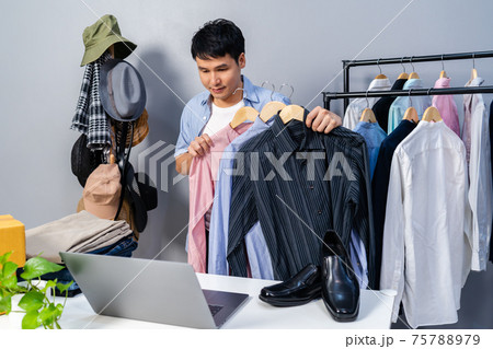 man selling clothes and accessories online by laptop computer live streaming, business online e-commerce at home 75788979