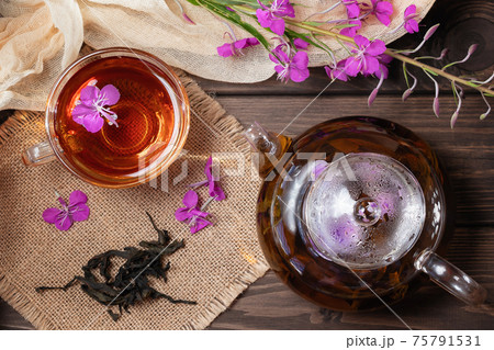 Herbal tea made from fireweed known as blooming sally in teapot and cup, top view 75791531