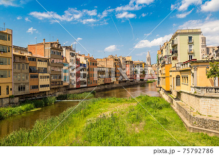 Colorful houses and Eiffel bridge in Girona 75792786