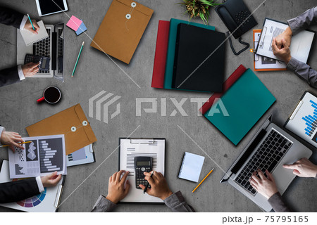 Top view group of professional business meeting and discussing strategy with new startup project. Top view group of professional business meeting and discussing strategy with new startup project. 75795165