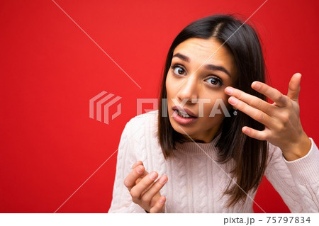 Closeup portrait of young beautiful brunette woman with short haircut with sincere emotions wearing Closeup portrait of young beautiful brunette woman with short haircut with sincere emotions wearing 75797834