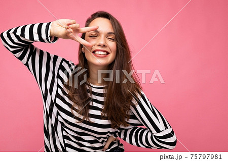 Young european positive smiling winsome happy beautiful brunette woman with sincere emotions wearing 75797981