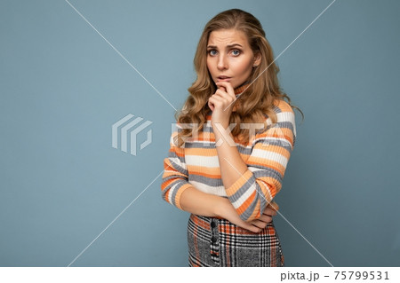 Photo portrait of young attractive beautiful sad upset thoughtful blonde woman with sincere emotions 75799531
