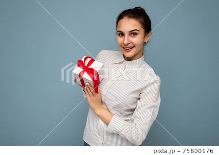 Beautiful happy young brunette woman isolated over colourful background wall wearing stylish casual Beautiful happy young brunette woman isolated over colourful background wall wearing stylish casual 75800176