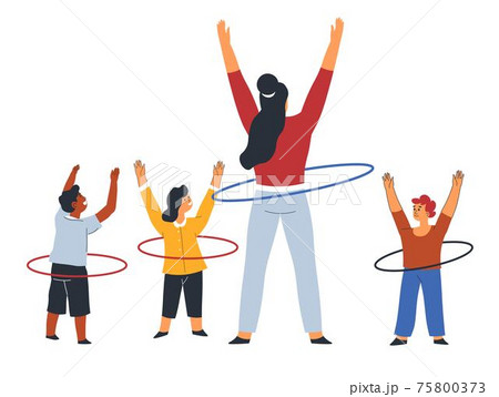 Teacher and children with hulahoop at PE lesson 75800373