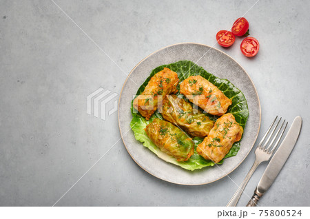 Golubtsi or golabki on plate on concrete table top. Stuffed cabbage rolls of russian, polish cuisine 75800524