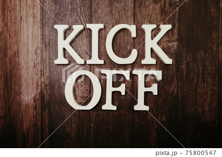 Kick Off alphabet letters on wooden background 75800547
