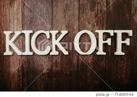 Kick Off alphabet letters on wooden background 75800548