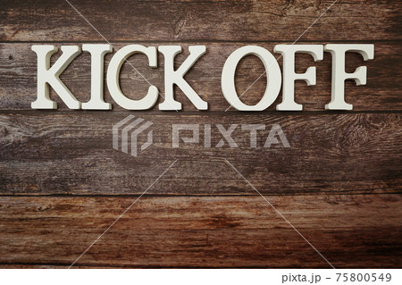 Kick Off alphabet letters on wooden background 75800549