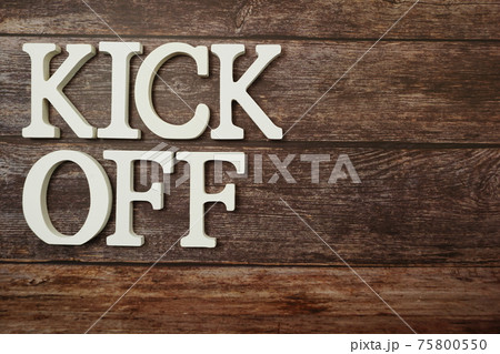 Kick Off alphabet letters on wooden background 75800550