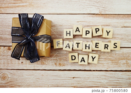 Happy Valentines day alphabet letter with gift present decoration on wooden background 75800580