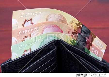 Canadian money in the black wallet Canadian money in the black wallet 75801887