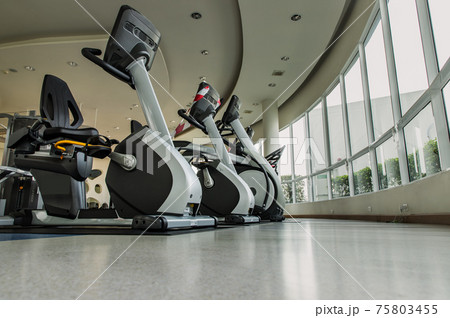 New normal concept and physical distancing people exercise on Training exercise bikes in fitness. New normal concept and physical distancing people exercise on Training exercise bikes in fitness. 75803455