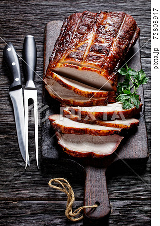 Barbecued Pork Loin Roast on a wooden board Barbecued Pork Loin Roast on a wooden board 75803947