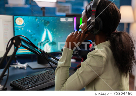 Professional gamer participating in esport tournament Professional gamer participating in esport tournament 75804466