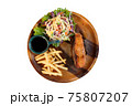 Set of fried salmon steak served on round wooden plate isolated on a white background 75807207