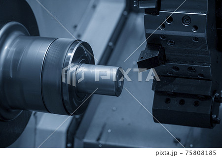 The CNC lathe machine cutting the metal shaft parts. The hi-technology metal working processing by CNC turning machine . The CNC lathe machine cutting the metal shaft parts. The hi-technology metal working processing by CNC turning machine . 75808185