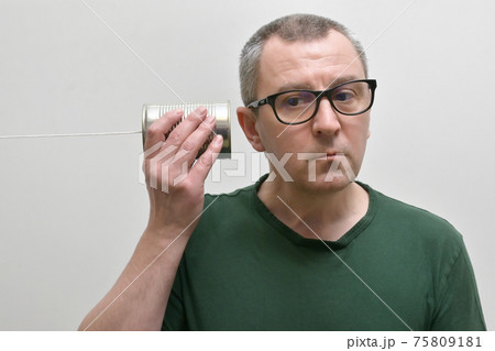 Portrait Of A Man Using A Tin Can Phone Portrait Of A Man Using A Tin Can Phone 75809181