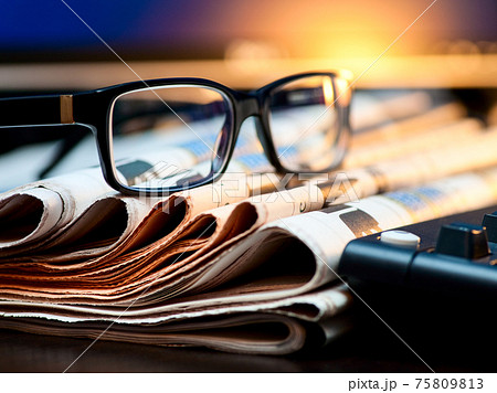 Glasses on newspapers Glasses on newspapers 75809813