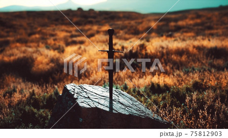famous sword excalibur of King Arthur in the rock 75812903