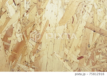 Pressed wooden shavings panel, texture of oriented strand board, OSB background 75812916