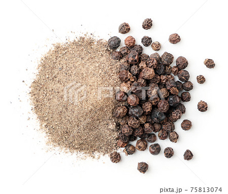 Black peppercorns and ground black pepper on a white background, isolated. Top view Black peppercorns and ground black pepper on a white background, isolated. Top view 75813074