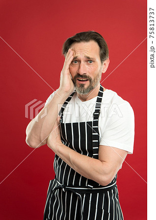 Lot of work. Confident mature handsome man in apron Lot of work. Confident mature handsome man in apron 75813737