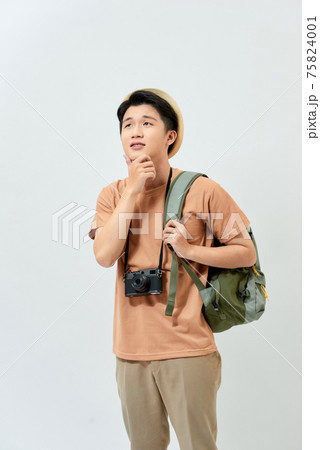 Young latin man wearing summer hat holding backpack face thinking about question with hand on chin, thoughtful about confusing idea 75824001