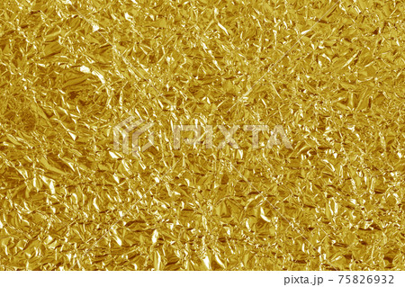 Gold foil leaf shiny texture, abstract yellow wrapping paper for background and design art work. Gold foil leaf shiny texture, abstract yellow wrapping paper for background and design art work. 75826932
