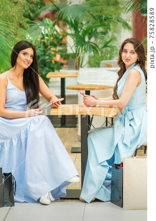 Two women sitting at the table 75828589