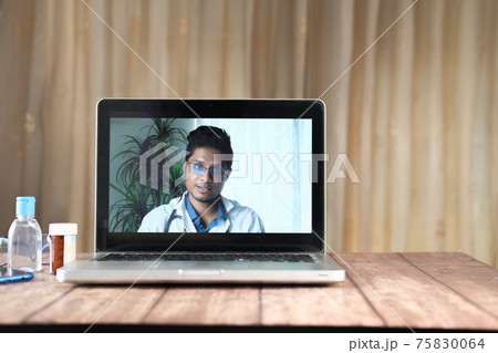 online consultation with doctor on laptop  75830064