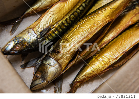 Smoked fish in craft paper box. Smoked fish in craft paper box. 75831311