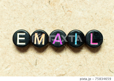 Black color round alphabet letter block in word email on wood background Black color round alphabet letter block in word email on wood background 75834659