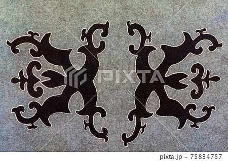 National Balkar pattern made with black thread on gray woolen fabric National Balkar pattern made with black thread on gray woolen fabric 75834757