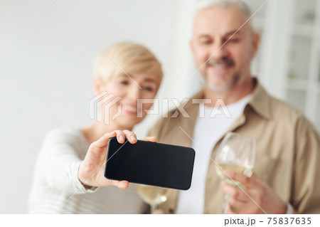 Selfie on modern phone, celebrate holiday and mobile app Selfie on modern phone, celebrate holiday and mobile app 75837635